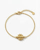 Gold bracelet with a unique clasp design on a white background