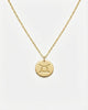 Gold necklace with a round pendant on a white background