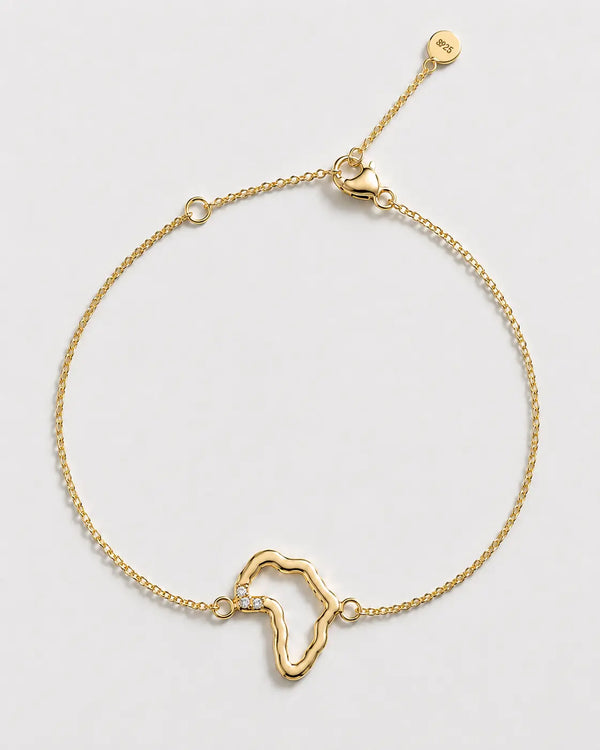 Gold bracelet with a unique design on a light gray background